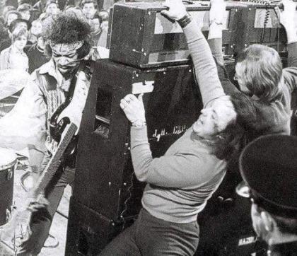 Hendrix with roadies holding marshall stacks